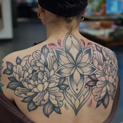 ornamental linework black and grey peony symmetry backpiece stipple dotwork pepper shading back tattoo