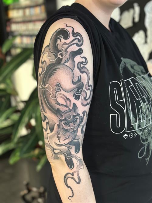 smokey cat black and grey pepper shading dotwork stippling sleeve tattoo